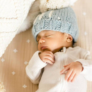 Introducing the Why Hi There Beanie - the cutest addition to any newborn's wardrobe! This blue hand knit baby beanie is complete with an adorable pom on top and is size 0-6 months. Say hello to the perfect gift for expecting parents or a precious addition to your own baby's collection. James 1:17
