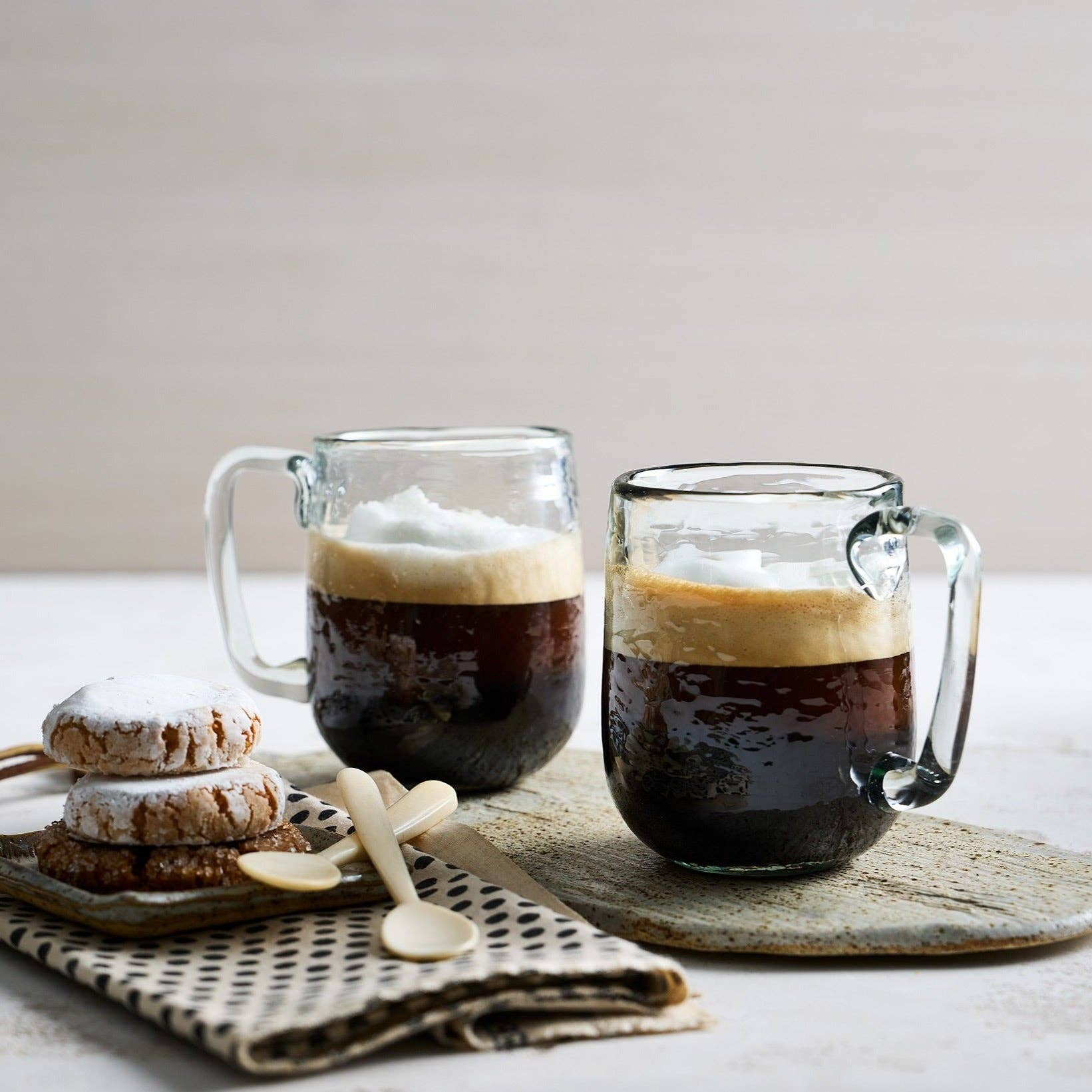 Enjoy a generous serving of your favorite hot beverage with our Pebbled Large Mug Set! These handcrafted glass mugs feature a unique hammered design for added texture. With a 12 oz capacity, you can share a cozy moment with a loved one. Available in a set of 2. Cheers!
