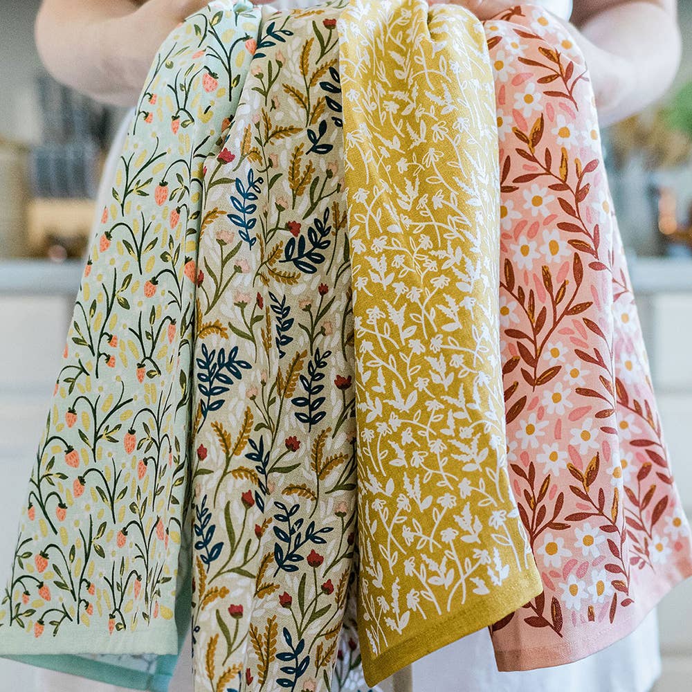 Spruce up your kitchen with our Tiny Floral Kitchen Towel! Made of 100% cotton, these tea towels are not only absorbent but also feature beautiful patterns that will brighten up your space. Perfect for spring, summer, and fall.