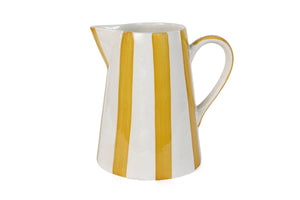 Elevate your home with this stylish and sturdy ceramic pitcher. Handcrafted with care, its playful stripes bring a touch of fun to your summer gatherings.

8.25 x 8.25 x 8
microwave and dishwasher safe
handpainted stoneware ceramic
artisan made