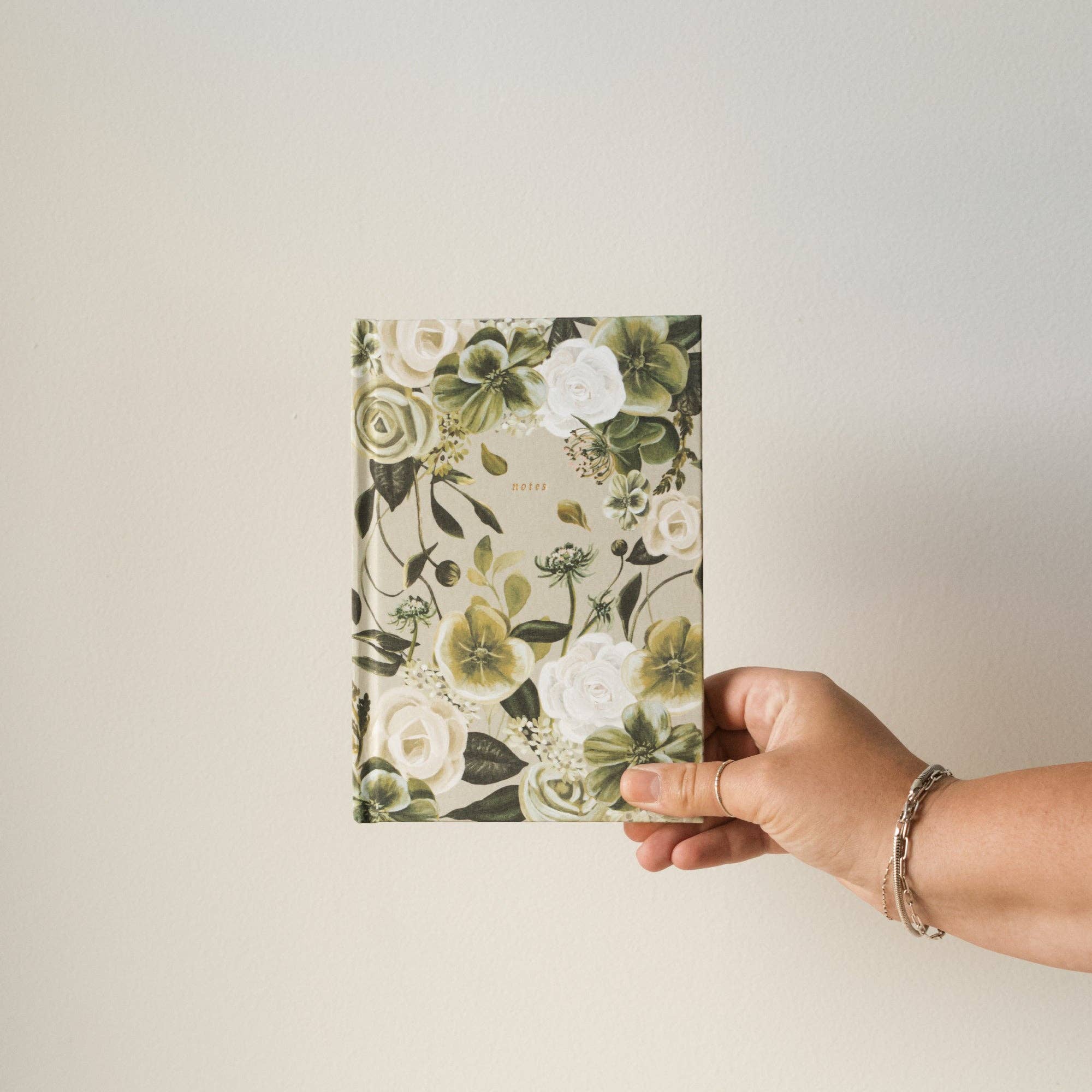 This notebook features the Lenten Rose paired with beautiful white garden roses and hydrangeas. Regardless of what you have walked through may the resilient nature of these flowers fill your heart with hope that your Heavenly Father is always there. Pair with our Lenten Rose Journaling Bible for a beautiful set.&nbsp;

•notebook

•journaling notebook

•hardcover