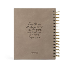 This planner includes a Month-at-a-Glance spread, a monthly calendar, weekly horizontal spreads, and extra note pages. With Scripture planted throughout the pages, each week has space to write out a “word for your week” in hopes that it would be a reminder of truth to guide your days.