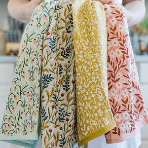 Spruce up your kitchen with our Tiny Floral Kitchen Towel! Made of 100% cotton, these tea towels are not only absorbent but also feature beautiful patterns that will brighten up your space. Perfect for spring, summer, and fall. 