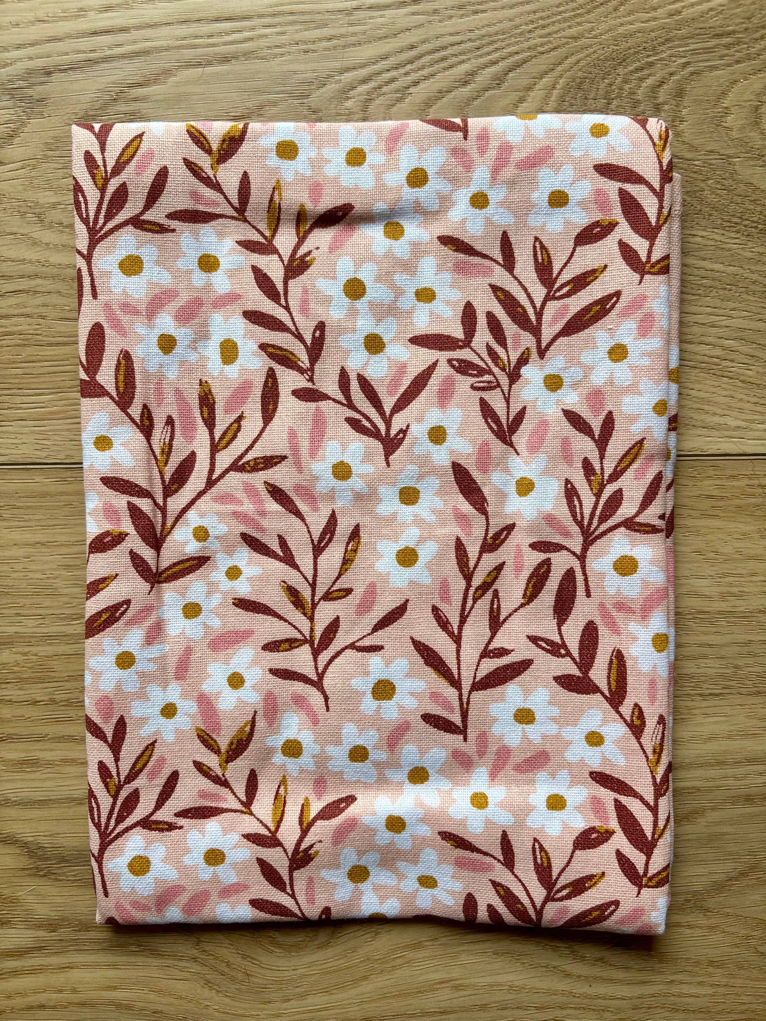 Spruce up your kitchen with our Tiny Floral Kitchen Towel! Made of 100% cotton, these tea towels are not only absorbent but also feature beautiful patterns that will brighten up your space. Perfect for spring, summer, and fall. 