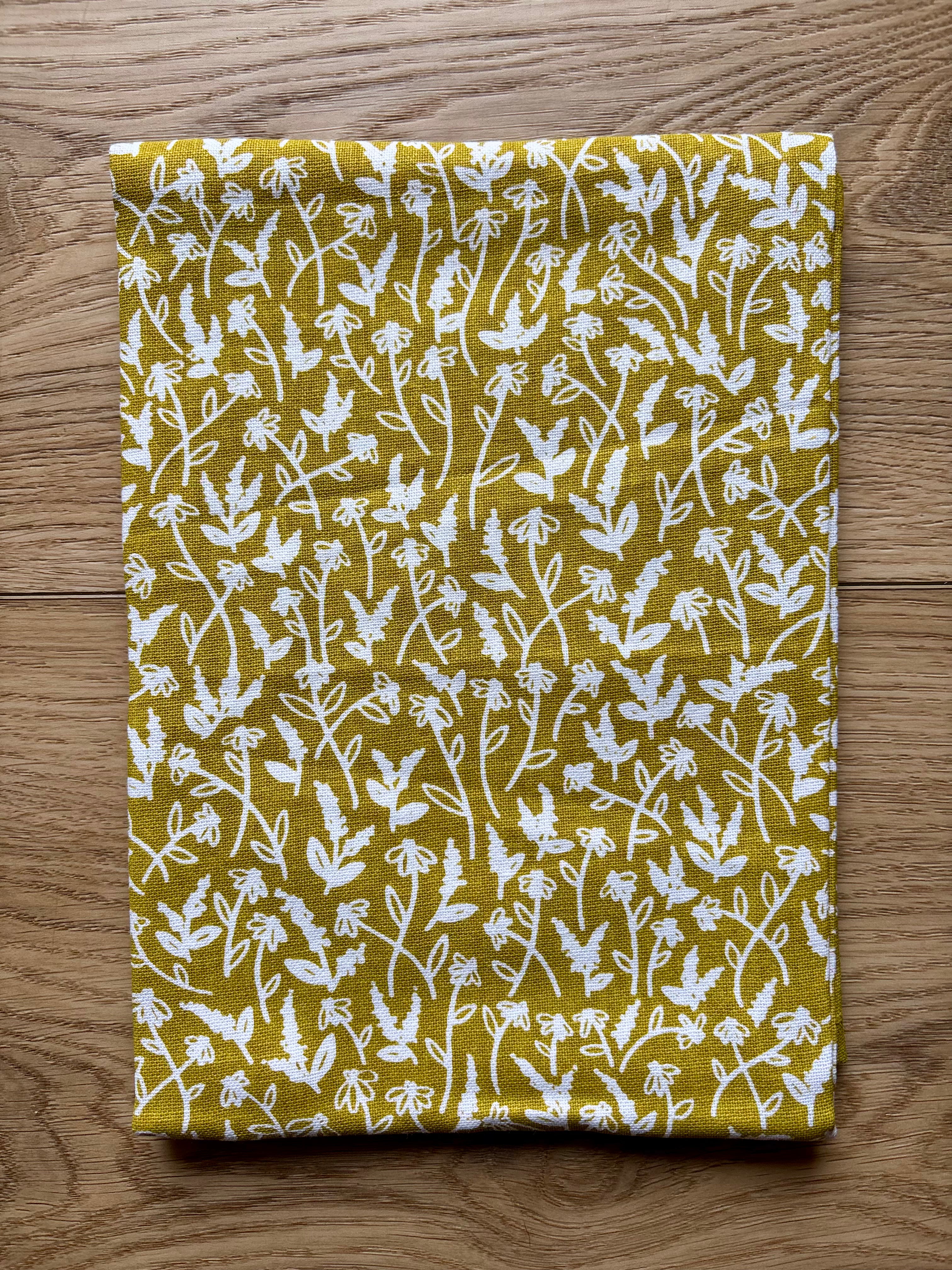 Spruce up your kitchen with our Tiny Floral Kitchen Towel! Made of 100% cotton, these tea towels are not only absorbent but also feature beautiful patterns that will brighten up your space. Perfect for spring, summer, and fall. 