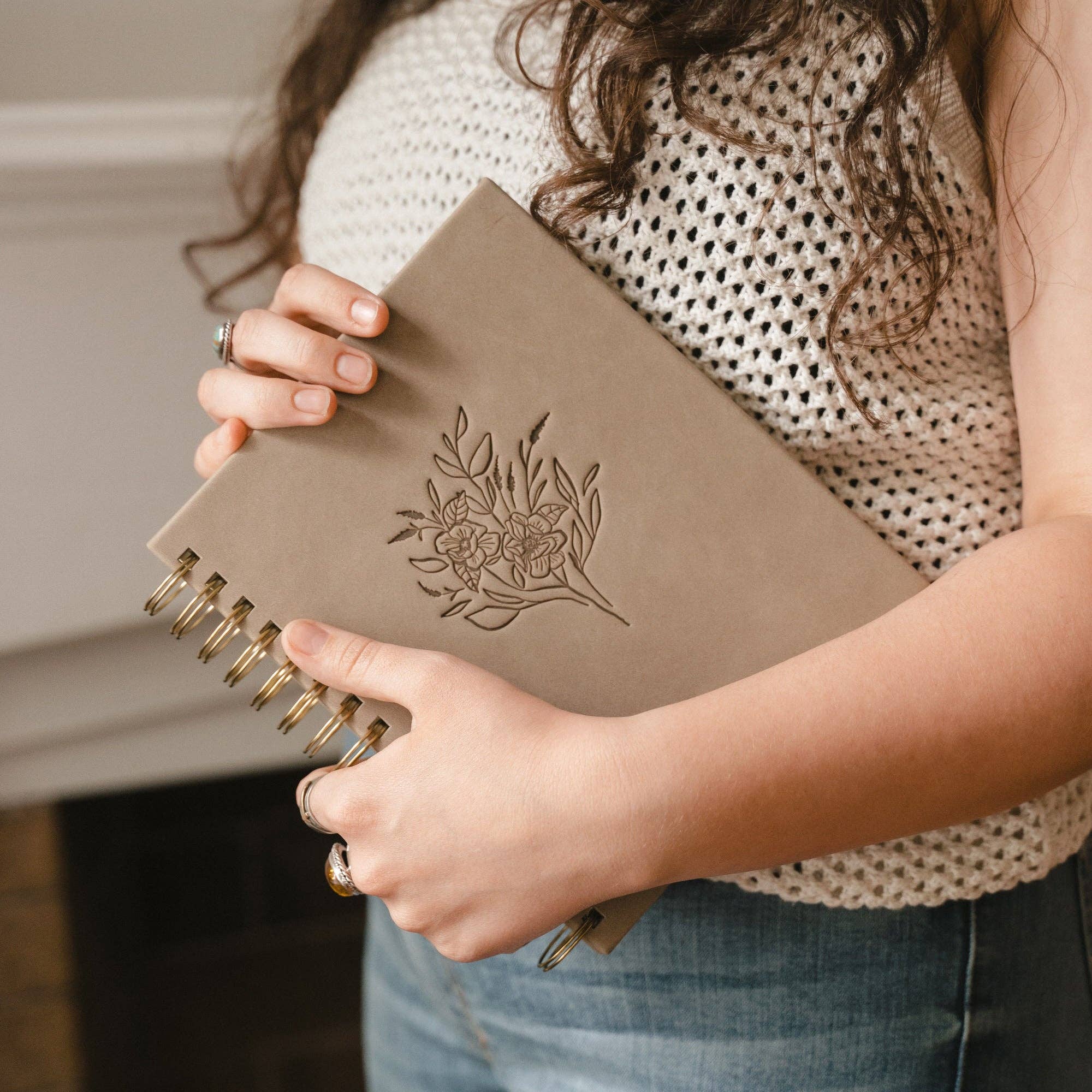 This planner includes a Month-at-a-Glance spread, a monthly calendar, weekly horizontal spreads, and extra note pages. With Scripture planted throughout the pages, each week has space to write out a “word for your week” in hopes that it would be a reminder of truth to guide your days.