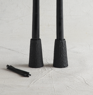 Thick, sand-cast aluminum forms are finished in a heavy, ash black textured coating, giving them a lava-like appearance. These taper holders fit standard candles and are backed with felt to prevent surface scratches.

Size: 2" x 2" x 3.25" Each.